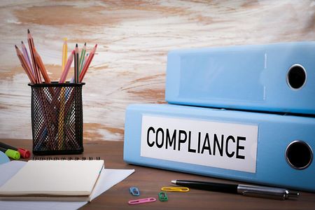 Ordner mit der Aufschrift Compliance