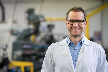 Portrait of a happy engineering teacher