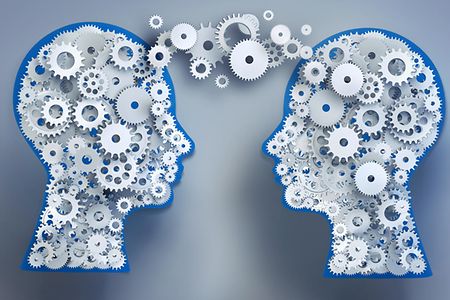 K&ouml;pfe mit Zahnr&auml;dern tauschen Gedanken aus