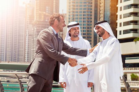 Businessmen struck a deal in Dubai.