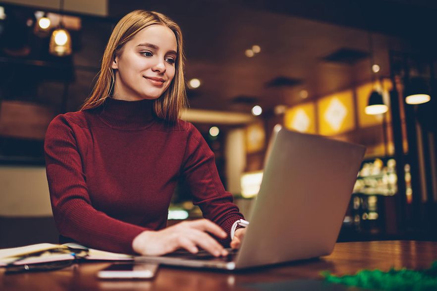 Positive,Woman,Enjoying,Shopping,Online,Searching,New,Items,In,Web
