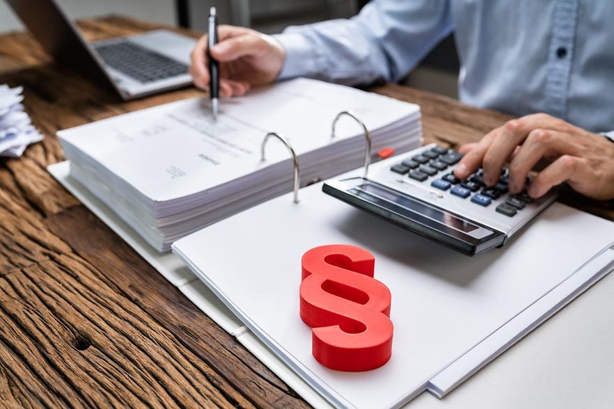 Red,Paragraph,And,Calculator,At,Judicial,Attorney,Desk