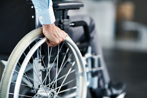 Wheelchair,,Disability,And,Man,Hand,Holding,Wheel,In,A,Hospital