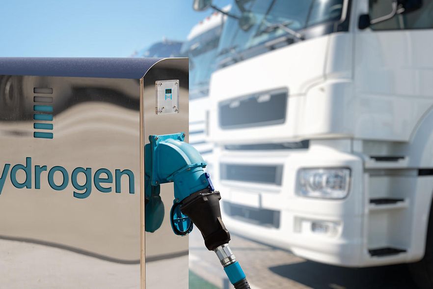 Hydrogen filling station on a background of trucks