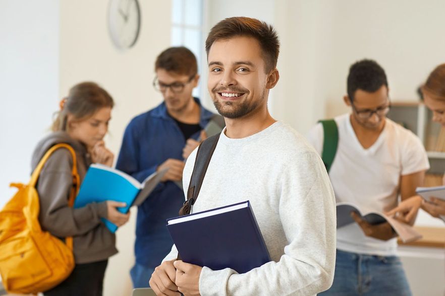 Portrait of smiling male student with backpack