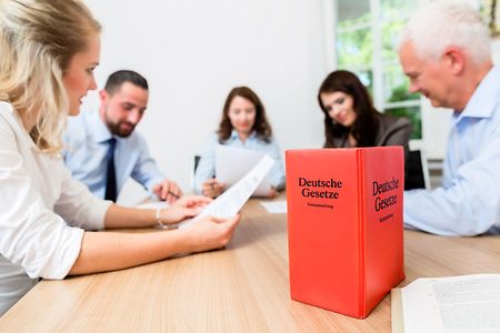 Lawyers in meeting negotiating agreement