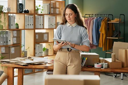 Woman,,Tablet,And,Checklist,For,Small,Business,,Ecommerce,And,Boutique