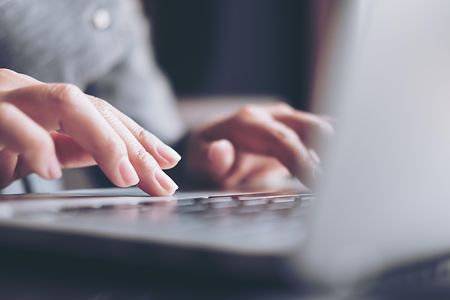 Closeup,Image,Of,A,Business,Woman's,Hands,Working,And,Typing