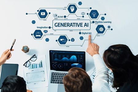 A,Diverse,Team,Collaborates,Around,A,Laptop,,Exploring,Generative,Ai