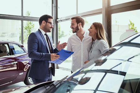 Young couple buying a car